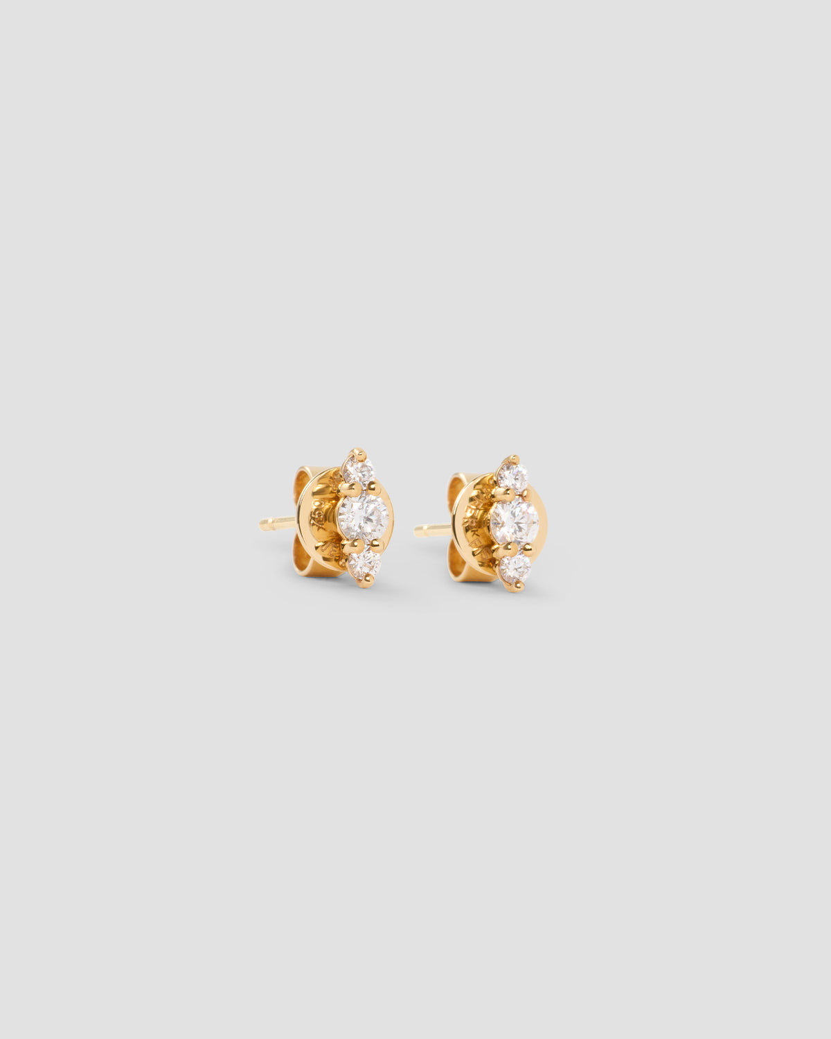 Floating Three Diamond Stud Earring gold earring - front view | diamond stud earrings