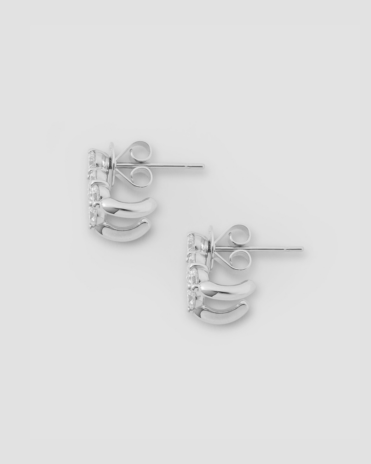 Floating Five Diamond Double Huggies 18K gold earring - alternate angle | diamond huggie earrings