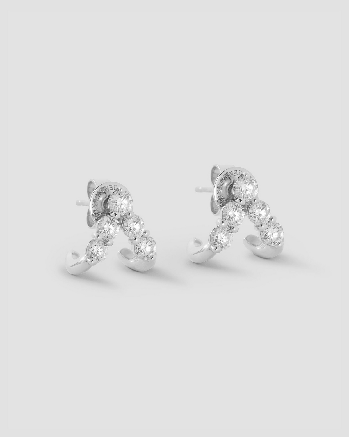 Floating Five Diamond Double Huggies 18K gold earring - styled on model | diamond huggie earrings