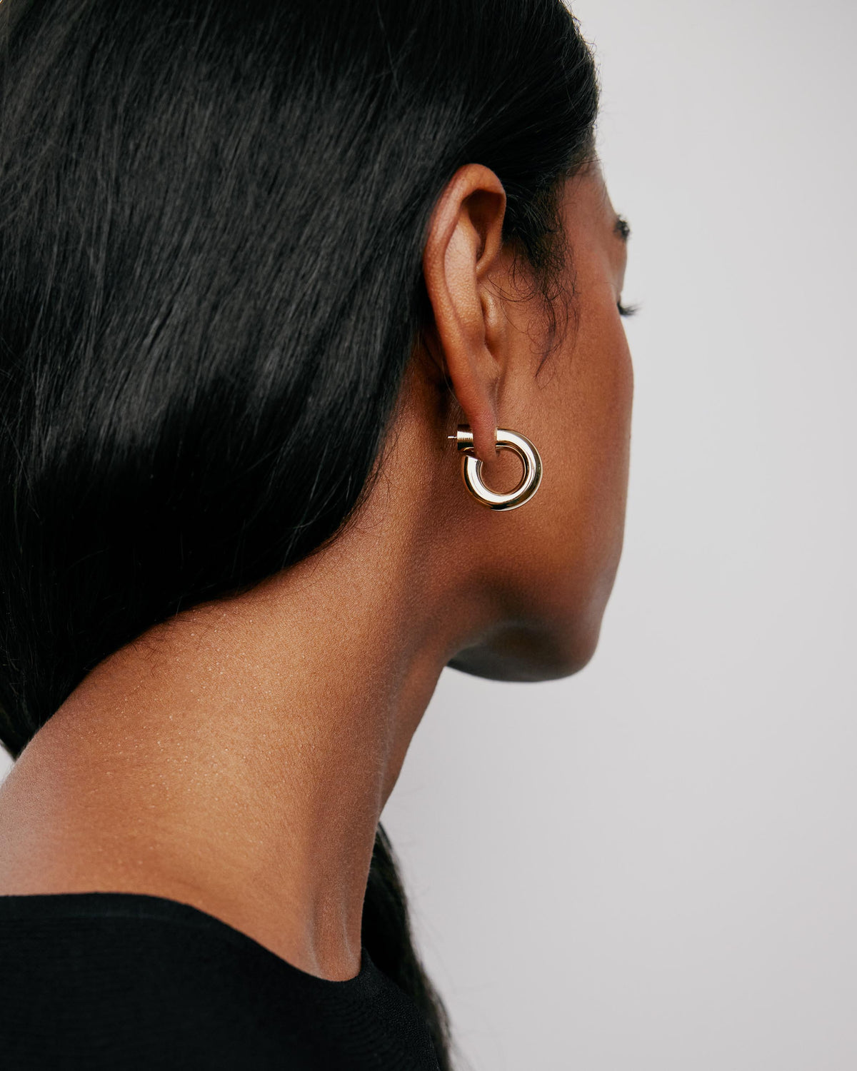Samira Micro Huggies earring - close-up detail | gold huggie earrings