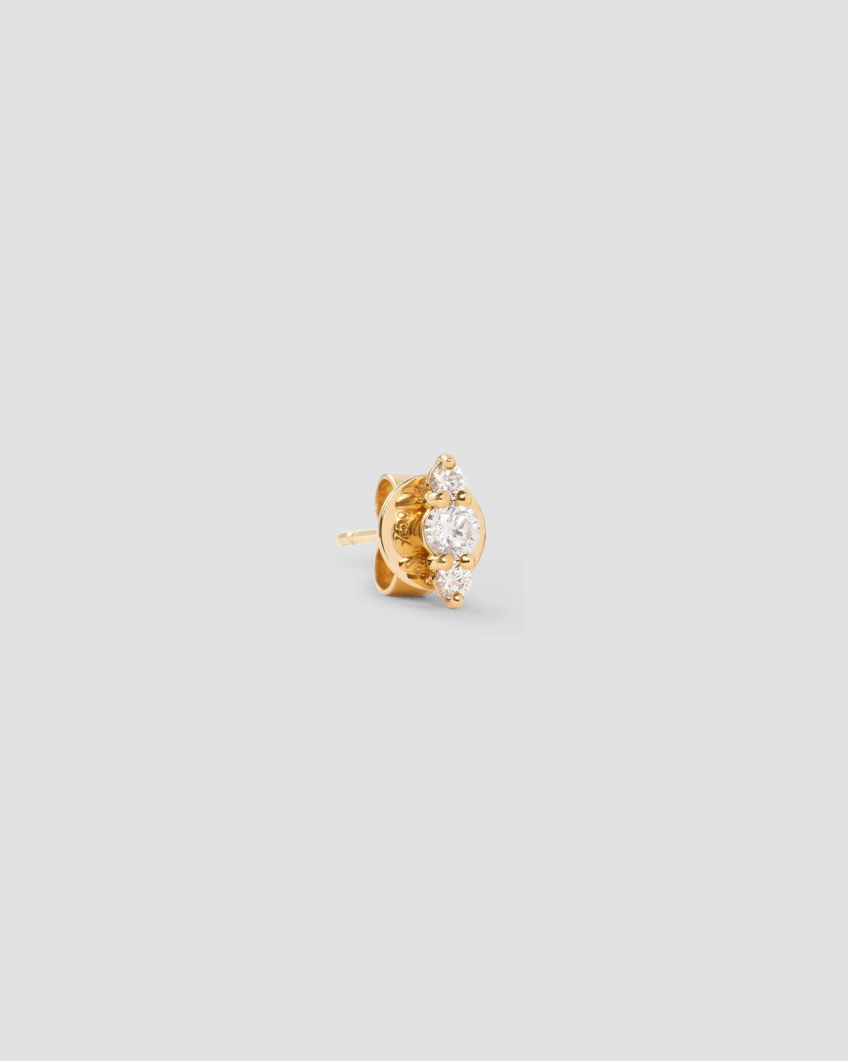 Floating Three Diamond Stud Earring gold earring - close-up detail | diamond stud earrings