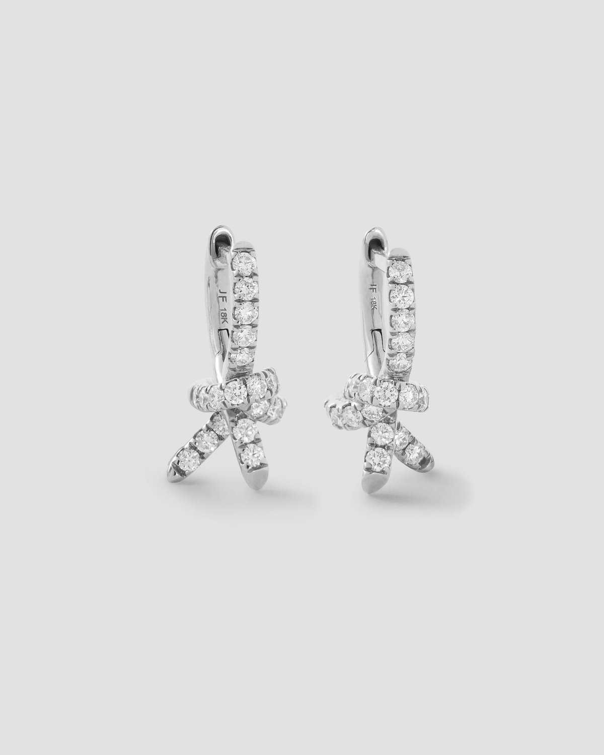 Knot Micro Huggie with Pavé White Diamonds gold earring - back view | diamond huggie earrings