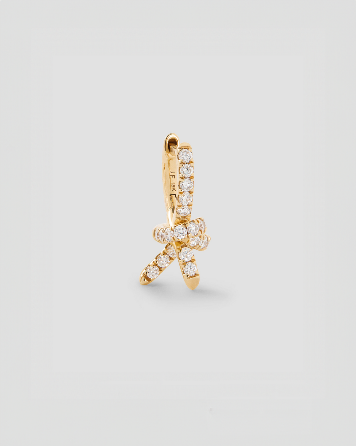 Knot Micro Huggie with Pavé White Diamonds gold earring - side view | diamond huggie earrings