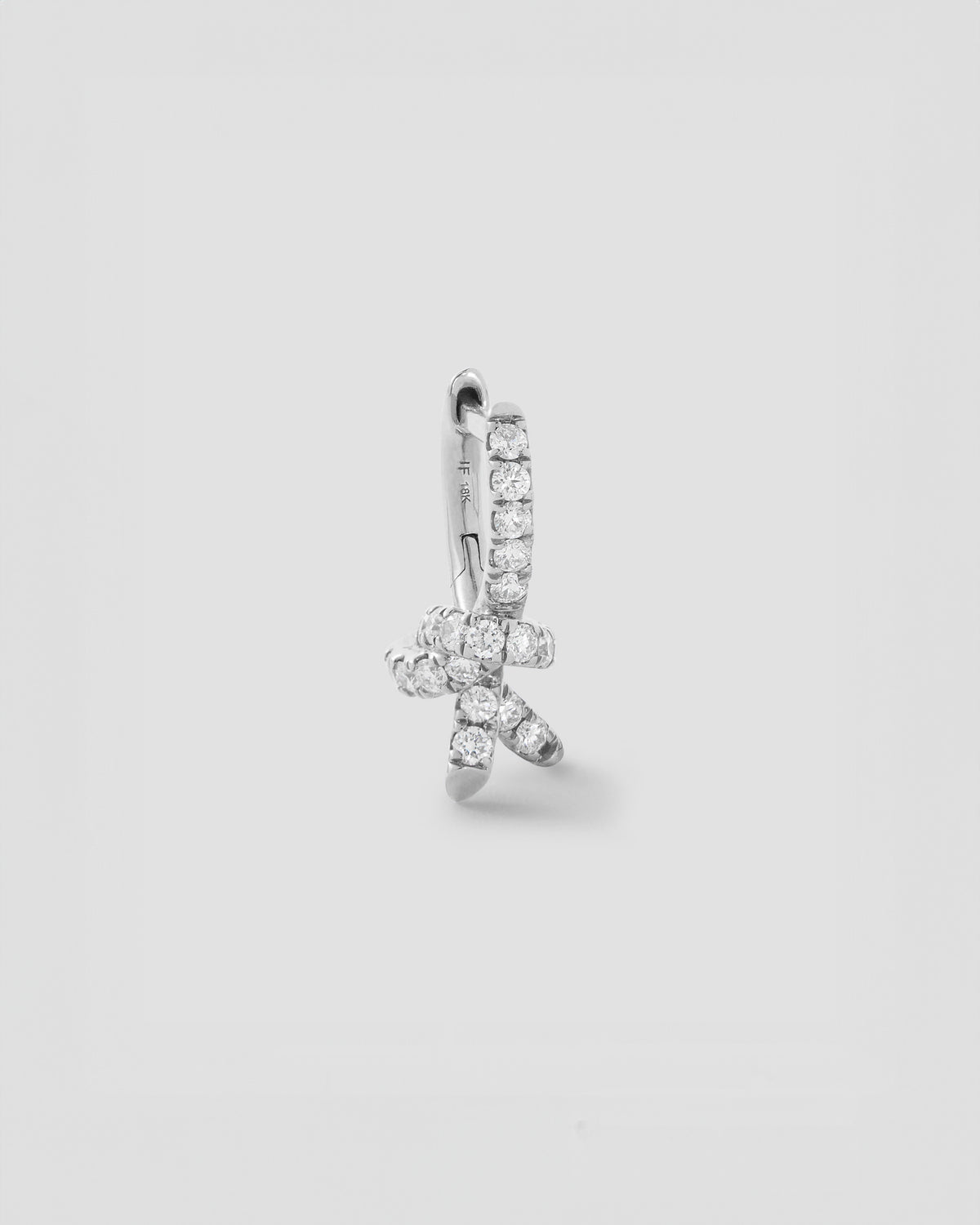 Knot Micro Huggie with Pavé White Diamonds gold earring - front view | diamond huggie earrings