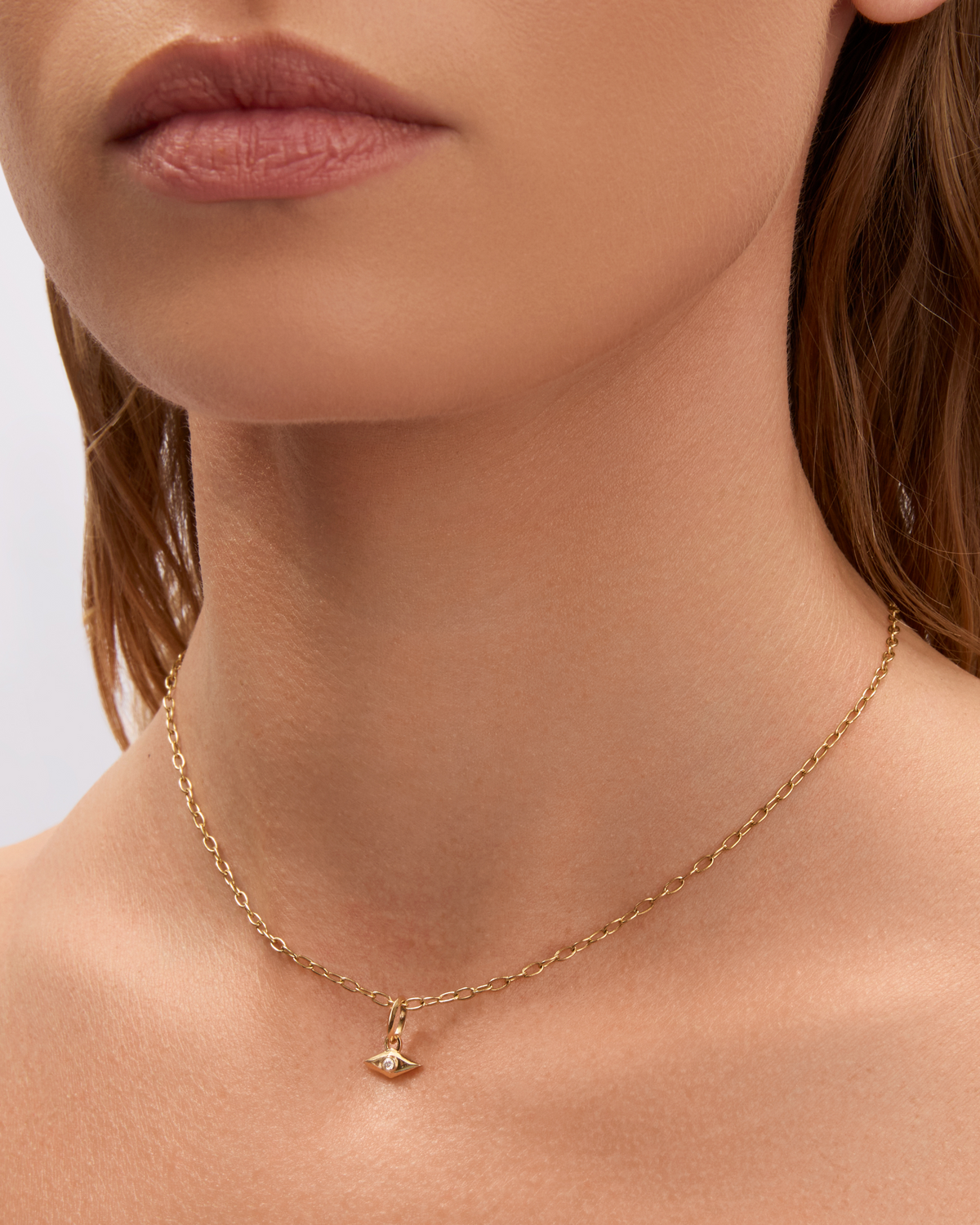Mini Evil Eye Charm gold charm - close-up detail | necklace with charms