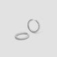 Madison Avenue Huggies gold earring - close-up detail | hoop earrings