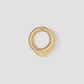 Gold ring with a textured design on a light gray background